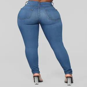 Back view of women's high waist skinny stretch denim jeans in blue denim wash