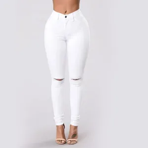 Vista frontale di jeans skinny bianchi strappati a vita alta con vestibilità stretch.