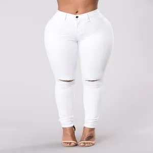Vista dettagliata dei jeans skinny bianchi a vita alta con strappi alle ginocchia e fit