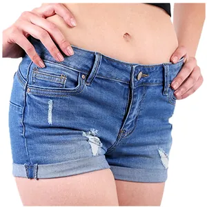 Detail view of women's distressed denim shorts with rolled hems for summer wear