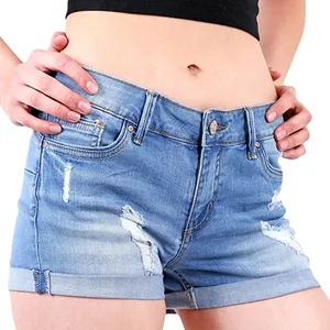 Detailed view of women's distressed blue denim shorts featuring a cuffed hem and casual style