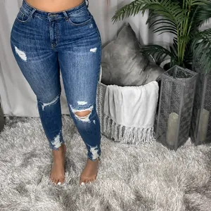 Jean skinny déchiré à taille haute pour femme en denim bleu foncé délavé élégant