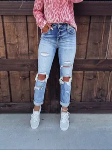 Stylish light blue ripped straight leg jeans for women with a vintage wash finish