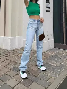 Stylish light blue high waisted stretch straight leg denim jeans for women in urban street setting