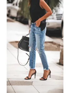 Stylish women's distressed straight-leg denim jeans with ripped knees and raw hems