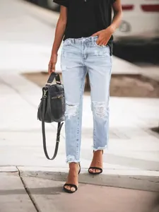 Casual light blue ripped straight-leg jeans for women with distressed hem and holes