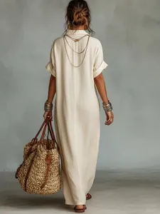 Back view of a loose-fitting beige cotton linen maxi dress for casual summer wear