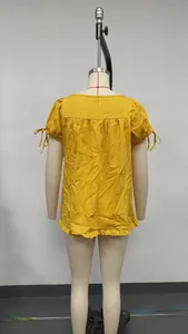 Back view of yellow ruffle square neck blouse with tie-up short sleeves on mannequin