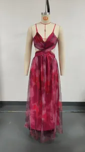 Red floral mesh maxi dress with cut-out waist design shown fully on a mannequin.