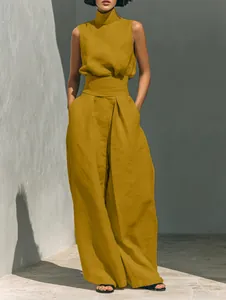 Detailed texture of mustard yellow cotton linen sleeveless top and wide-leg trousers set.