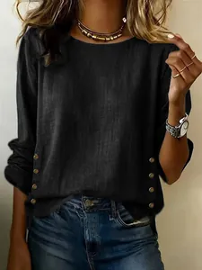 Detailed view of women casual black cotton linen long sleeve top with side button accents