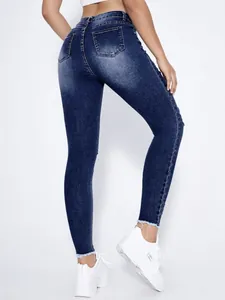Detailansicht von hinten: Dunkelblaue zerrissene Skinny-Jeans für Damen mit Stretch-Saum