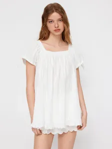 White square neck blouse with tie-up puff sleeves and delicate eyelet ruffle hem