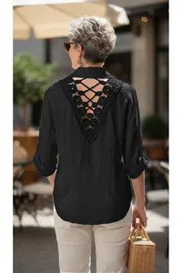 Detailed back view of a black lace-up shirt with elegant crochet lace embroidery