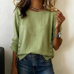 Loose fit light green cotton linen blouse with round neck and side button details
