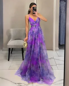 Full-length detail of purple floral mesh maxi dress with spaghetti straps and pleated waist