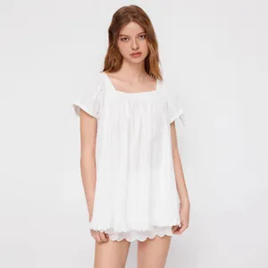 Elegant white square neck short sleeve blouse with ruffle trim and feminine tie-knot sleeves