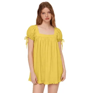 Casual yellow square neck blouse featuring puff sleeves with ties and a ruffled hemline