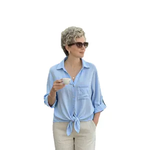 Light blue V-neck button-up shirt featuring a stylish casual front tie knot on a model