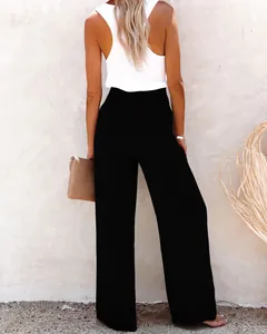 Rear view of loose black wide-leg cotton linen trousers for a casual summer look.
