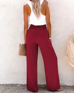 Detailed back view of stylish burgundy wide-leg linen pants featuring an elastic waist