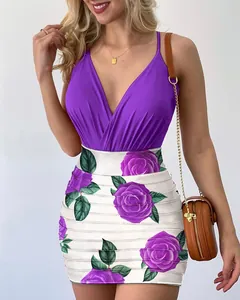 Close-up view of a purple V-neck top with a purple rose print bodycon skirt detail