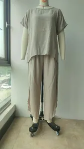 Full view of women's casual loose two-piece set with short sleeve top and trousers
