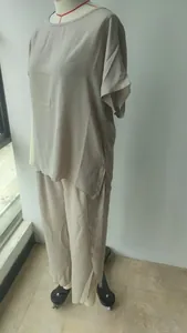 Detailed view of women's beige 2-piece casual set with loose short sleeve top and pants