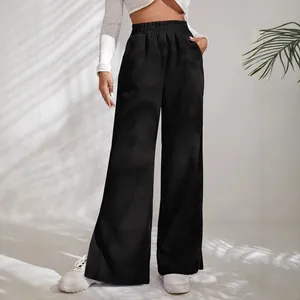 Women's high waist black corduroy wide-leg pants with stylish side slit hem detail