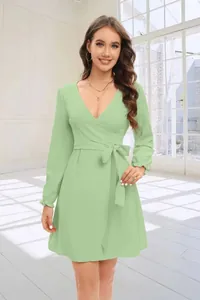 Detail view of a sage green wrap V-neck dress with lantern sleeves and a waist tie.