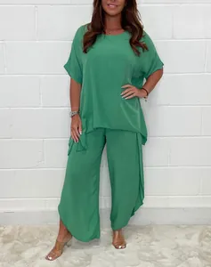 Detailed look at the vibrant green short-sleeve top and flowy wide-leg pants set