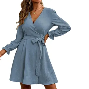 Elegant solid color wrap V-neck lantern sleeve dress with a waist tie belt in dusty blue