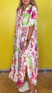 Woman wearing a bohemian printed maxi dress with colorful floral patterns and lapel collar