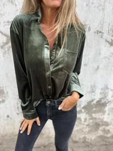 Detailed close-up view of women's stylish olive green velvet long sleeve shirt