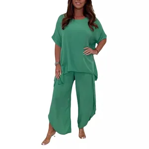 Women's stylish green two-piece lounge set with loose short sleeves and wide pants