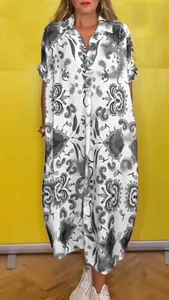 Detail of a casual loose maxi dress with bold black and white floral print and lapel