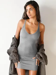 Close-up of grey ribbed V-neck mini dress showing bodycon fit and trendy Y2K style
