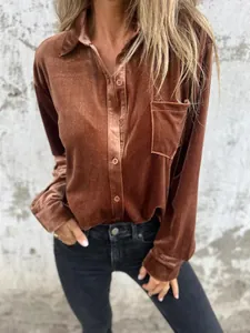 Close-up detail of copper velvet long-sleeve button-down shirt showing rich texture.