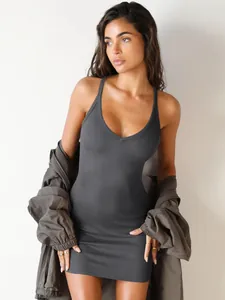 Sleek dark grey ribbed bodycon mini dress for women paired with a stylish casual jacket