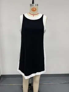 Front detailed view of black and white color block sleeveless tunic top on a dress form