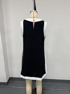 Back view of a casual black and white color-block sleeveless top for women