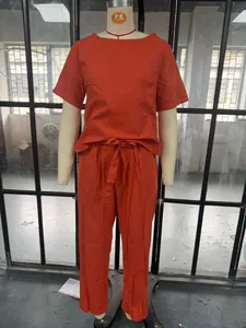 Detail view of a burnt orange two-piece cotton linen loungewear set on a mannequin