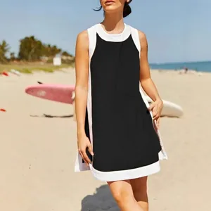 Women's casual summer color-block sleeveless top and shorts set in a beach setting