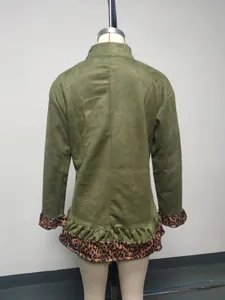 Detail view of long-sleeved olive green dress featuring leopard print ruffled hem and cuffs