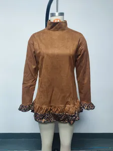 Detailed front view of brown turtleneck long sleeve dress with leopard print ruffle trim