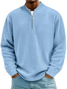 Close-up of light blue ribbed men's pullover with quarter-zip mock neck detail.
