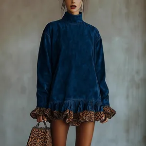 Detailed view of high neck blue velvet dress with leopard print ruffle hem.