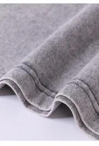 Detailed macro shot of grey 240G pure cotton washed vintage fabric texture and seams