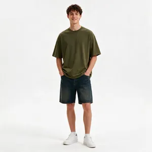 Full-body view of male model in olive green oversized cotton t-shirt