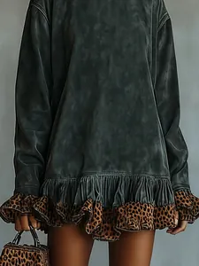 Detailed view of a washed grey dress with leopard print ruffled hem and matching leopard bag.